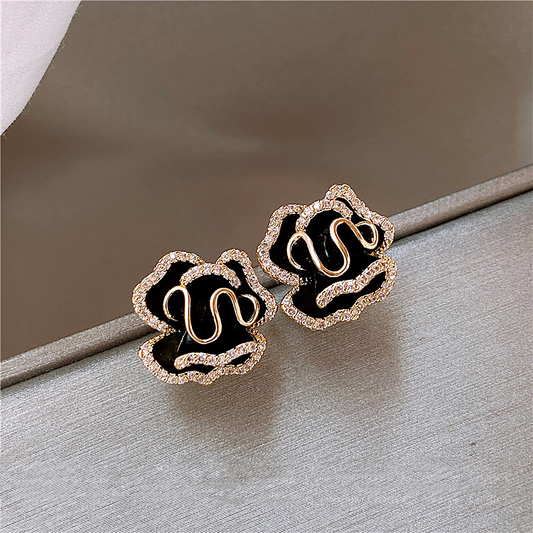 Elegante schwarze Lotus-Ohrringe mit Glitzerelementen