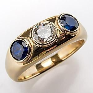 Goldring mit Zirkonia und blauem Kristall