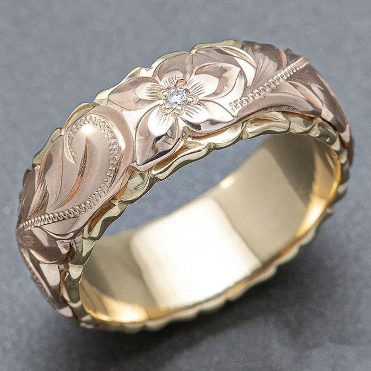 Goldener Ring mit rosa Blumenelementen