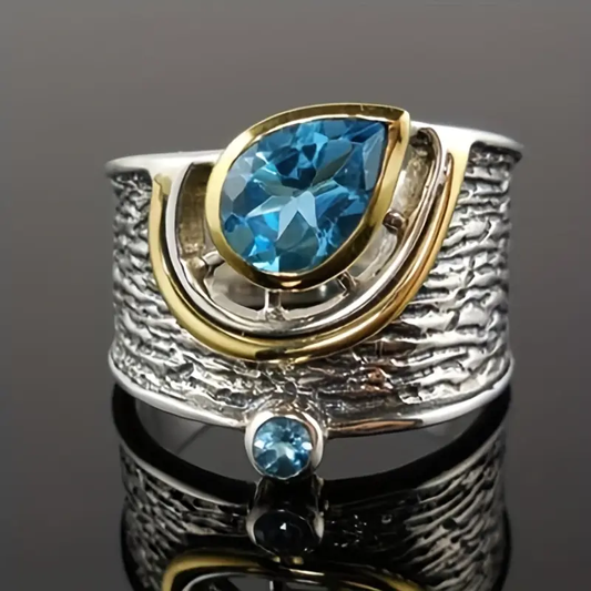Ring aus Silber & Gold mit blauen Kristallen